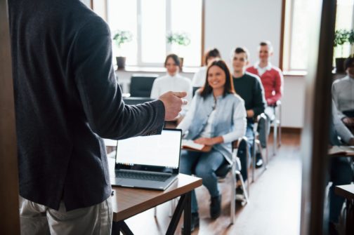 cheerful-mood-group-of-people-at-business-conference-in-modern-classroom-at-daytime-min-min-min
